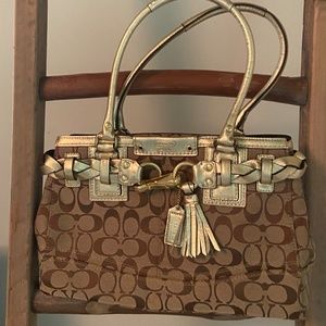 Cute gold and tan Coach purse